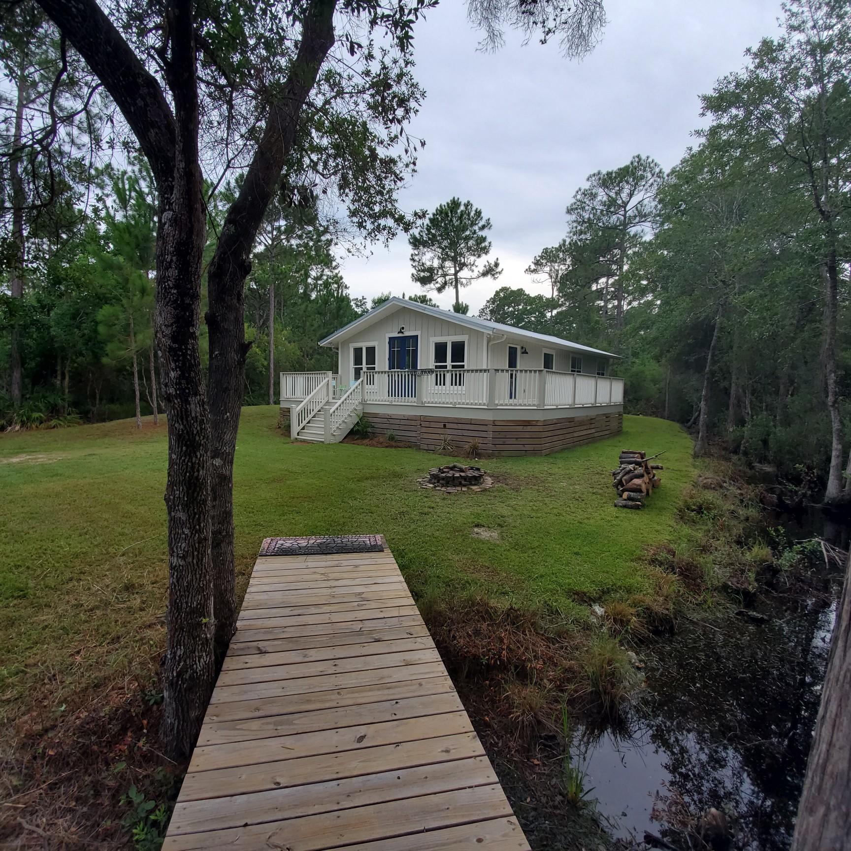 59 Chelsey Lane Santa Rosa Beach, FL 32459 - Photo 28 of 31 a front view of a house with yard
