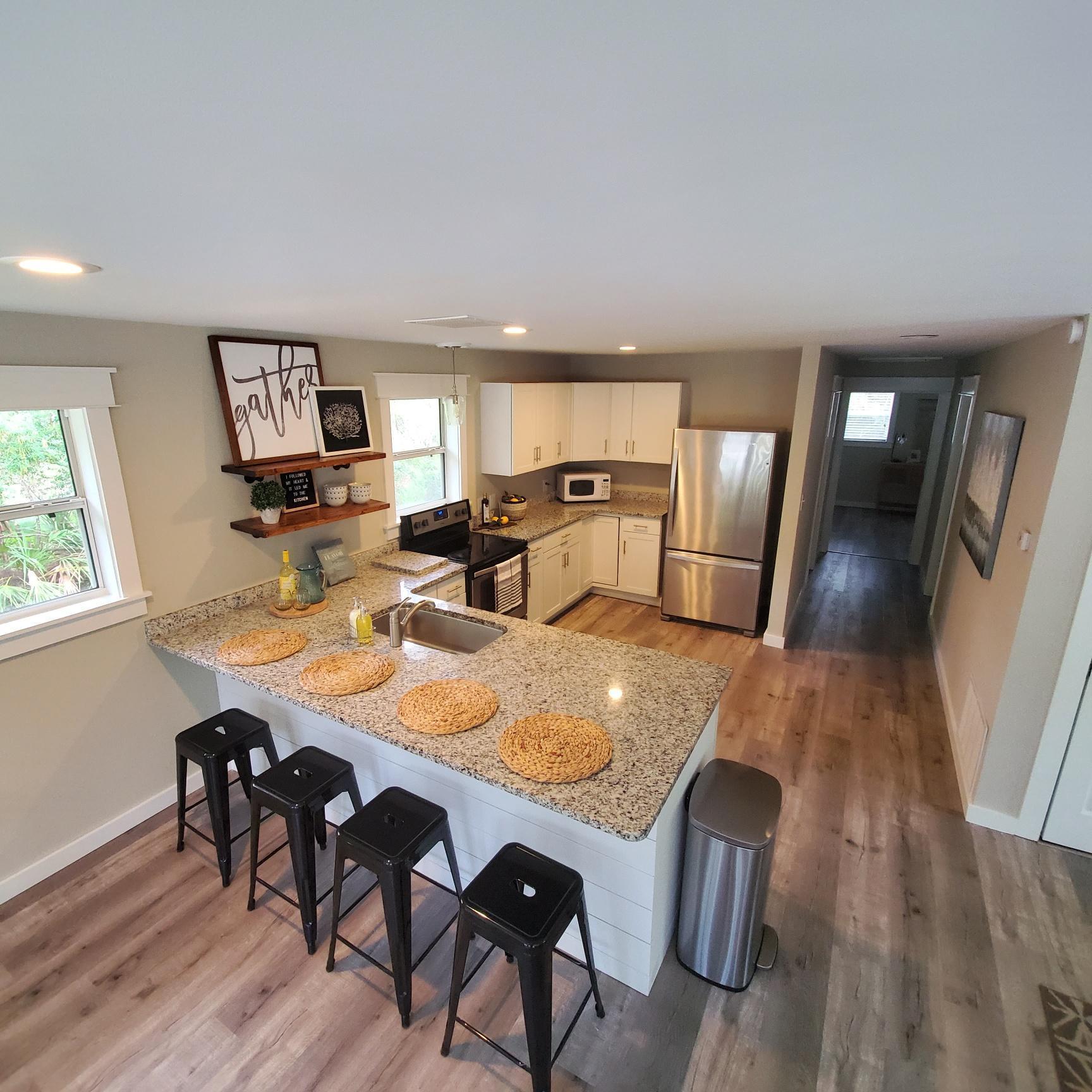 59 Chelsey Lane Santa Rosa Beach, FL 32459 - Photo 4 of 31 a view of a dining room with furniture and wooden floor