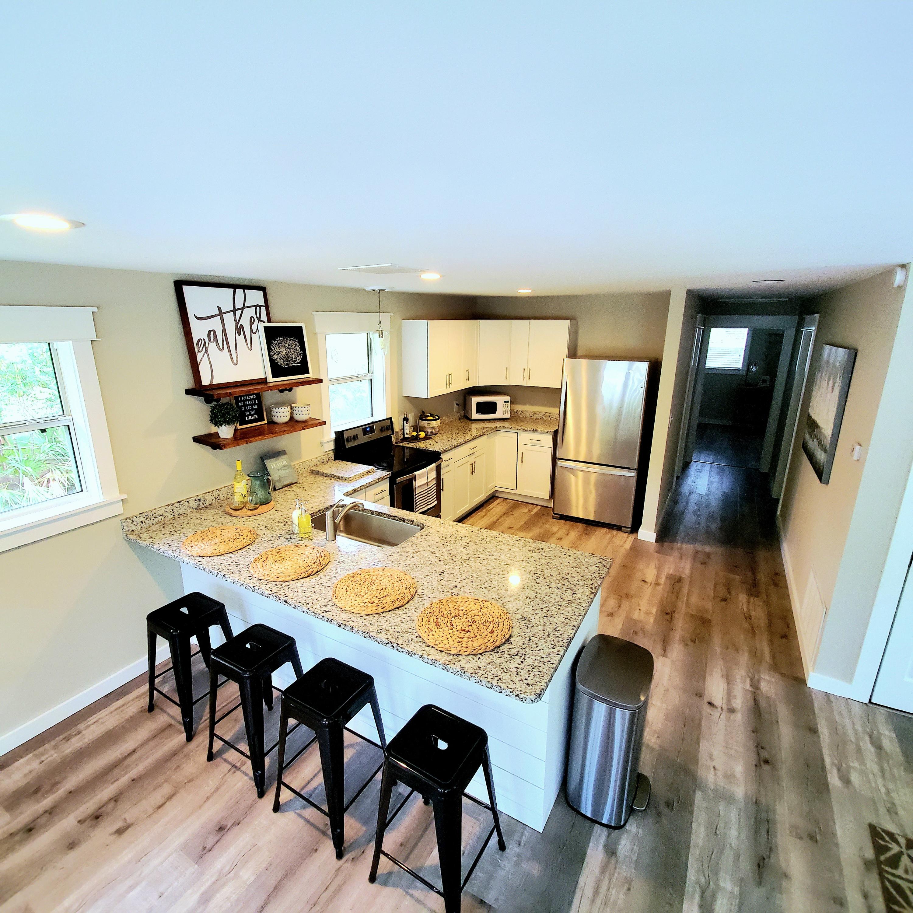 59 Chelsey Lane Santa Rosa Beach, FL 32459 - Photo 5 of 31 a view of a dining room with furniture and wooden floor