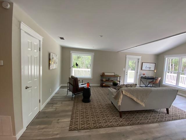 59 Chelsey Lane Santa Rosa Beach, FL 32459 - Photo 10 of 31 a living room with furniture windows and a wooden floor