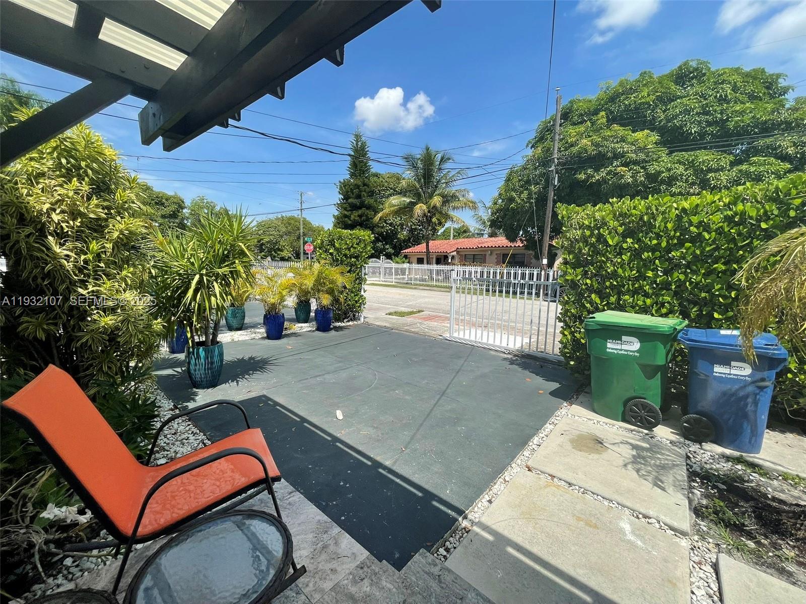 210 Northeast 110th Street Miami, FL 33161 - Photo 17 of 26 a backyard of a house with outdoor seating