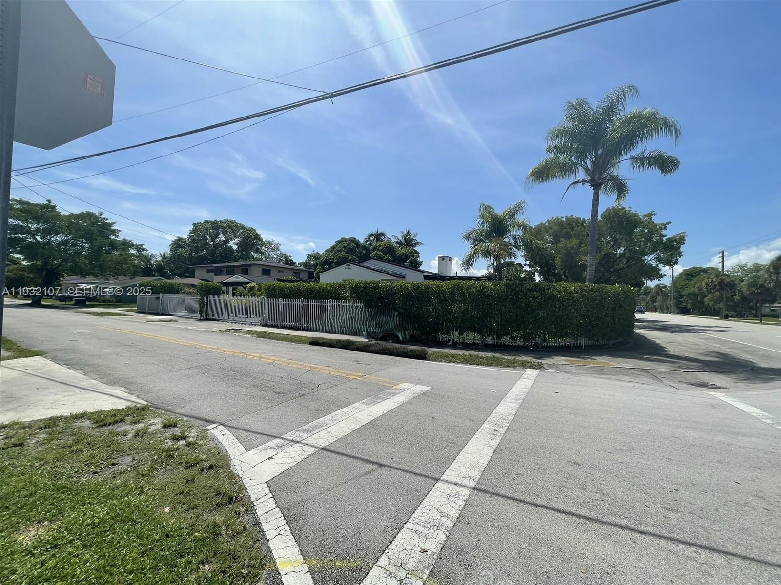210 Northeast 110th Street Miami, FL 33161 - Photo 2 of 26 a view of a street with a building in the background