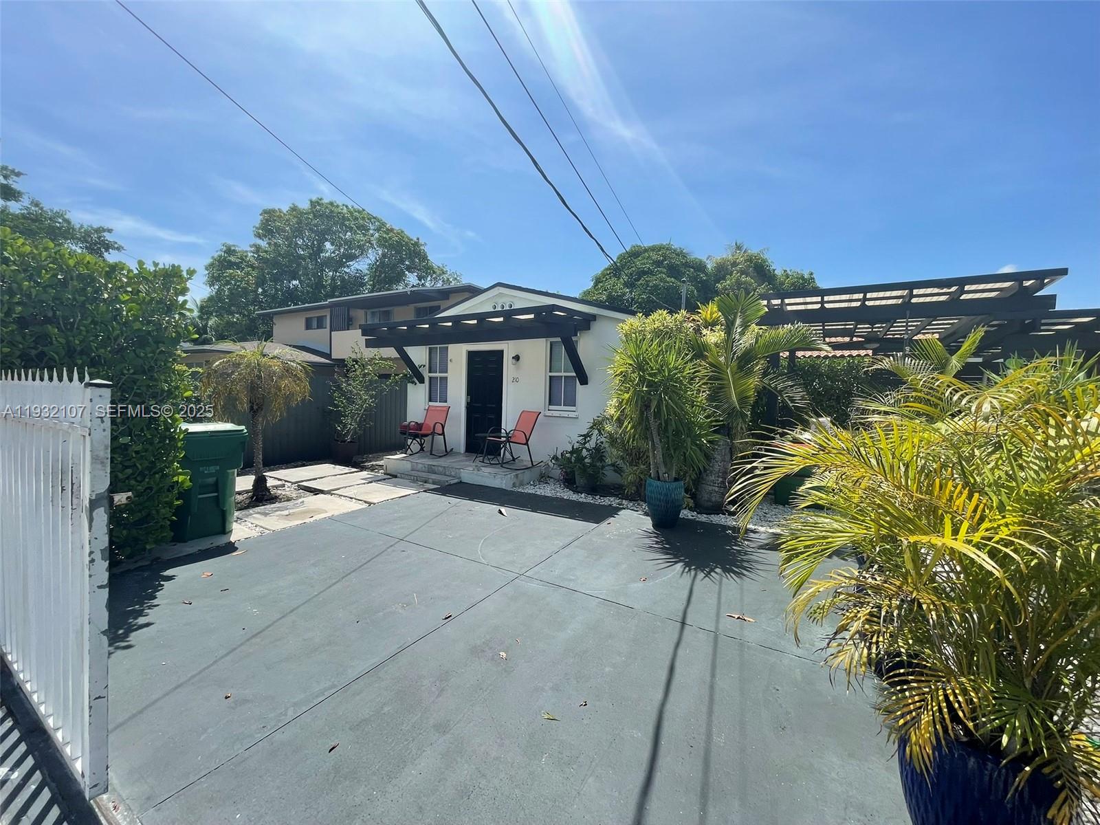 210 Northeast 110th Street Miami, FL 33161 - Photo 3 of 26 a view of a house with a yard