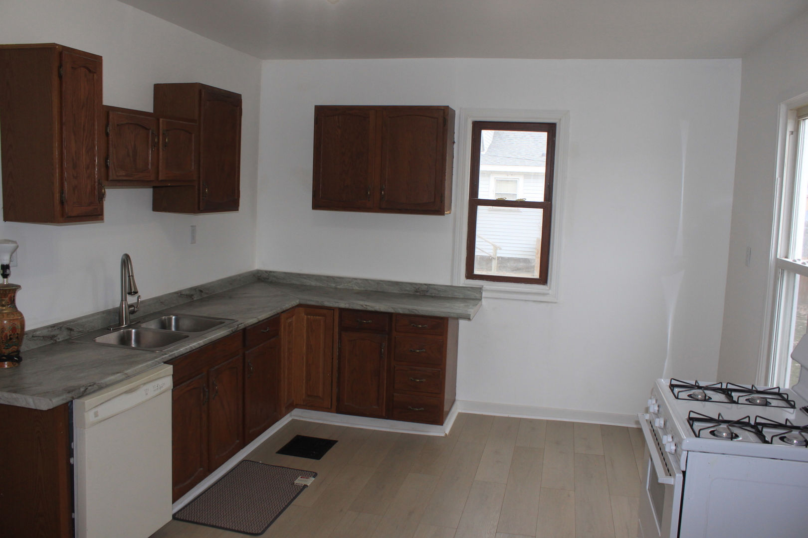 511 3rd Avenue Rock Falls, IL 61071 - Photo 2 of 9 a kitchen with stainless steel appliances granite countertop a sink stove and microwave