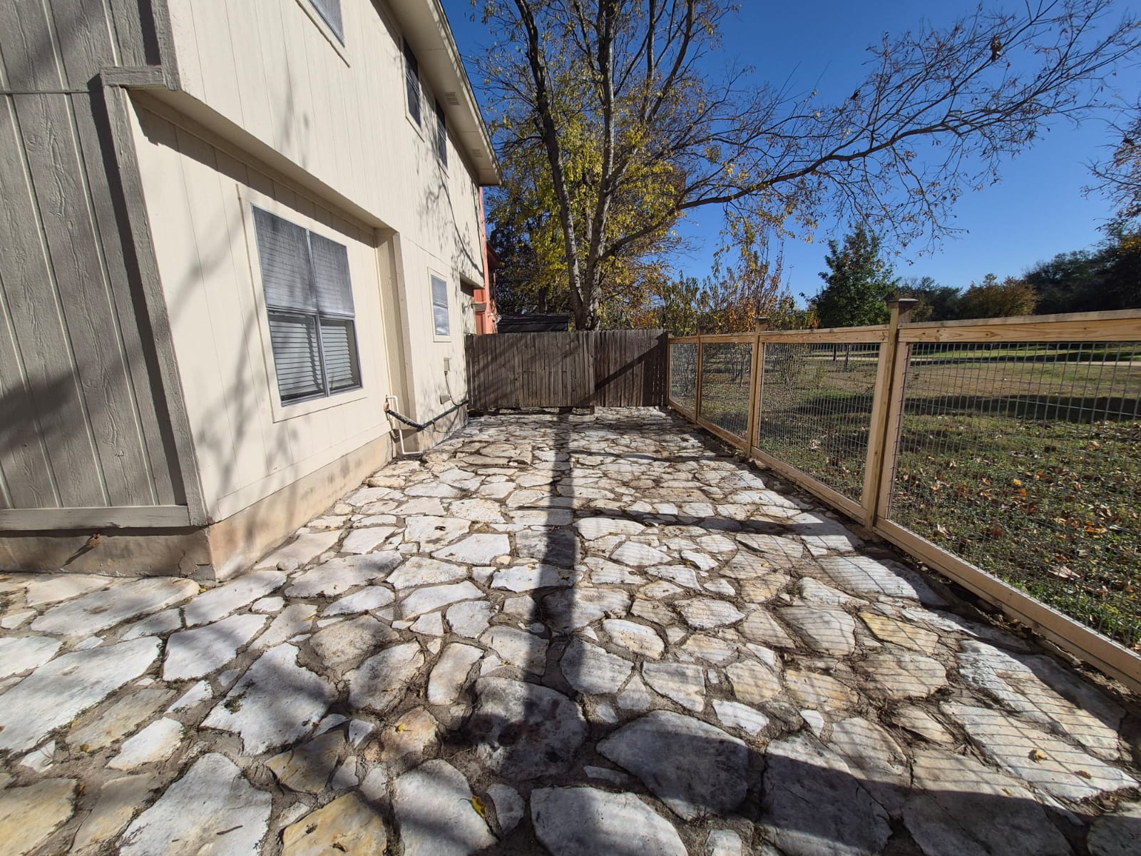 12915 Marimba Trail Austin, TX 78729 - Photo 12 of 15 Fenced backyard with a patio