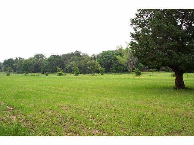 12915 Marimba Trail Austin, TX 78729 - Photo 15 of 15 View of green lawn with a view of rural / pastoral area