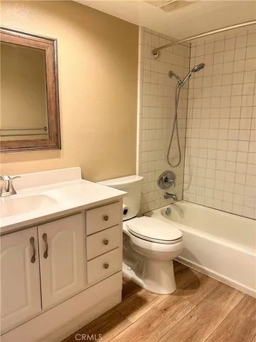 a bathroom with a toilet sink and shower