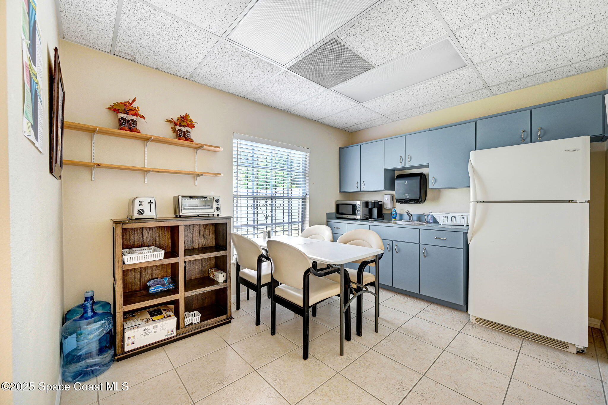 1801 Sarno Road, Unit 5 & 6 Melbourne, FL 32935 - Photo 19 of 44 a kitchen with a refrigerator a stove a sink dishwasher and cabinets with wooden floor