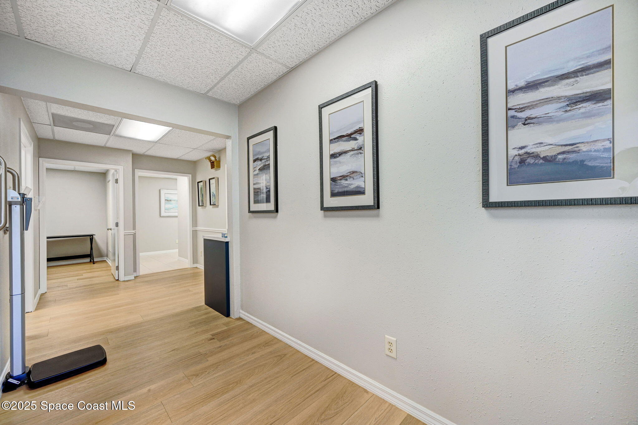 1801 Sarno Road, Unit 5 & 6 Melbourne, FL 32935 - Photo 23 of 44 a view of a hallway with wooden floor and a bathroom