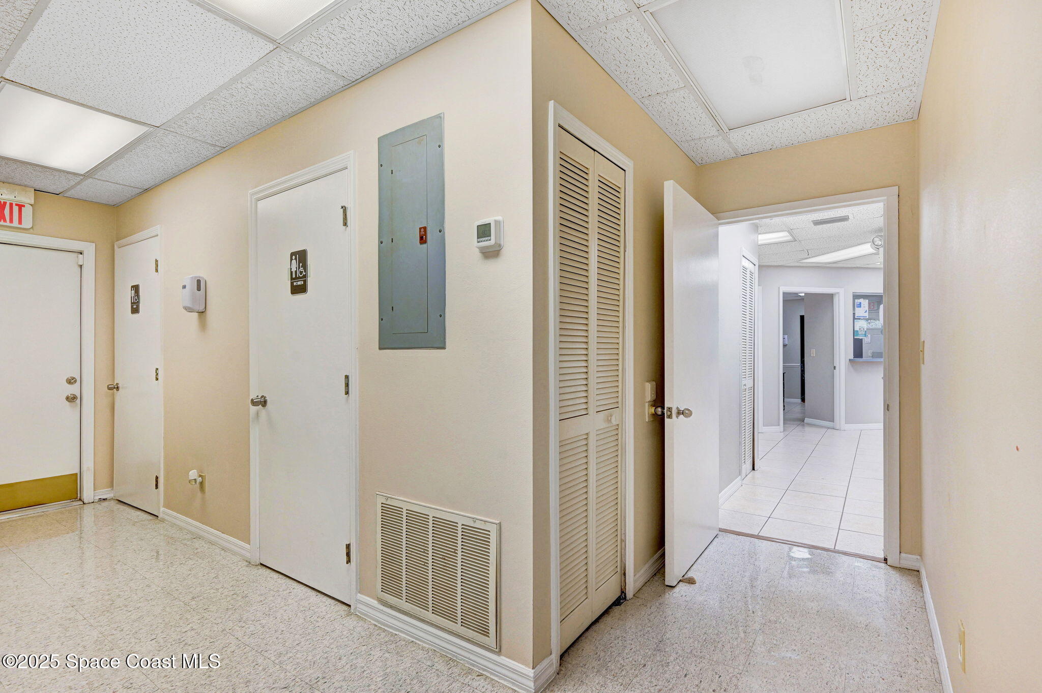 1801 Sarno Road, Unit 5 & 6 Melbourne, FL 32935 - Photo 26 of 44 a view of a hallway with wooden floor