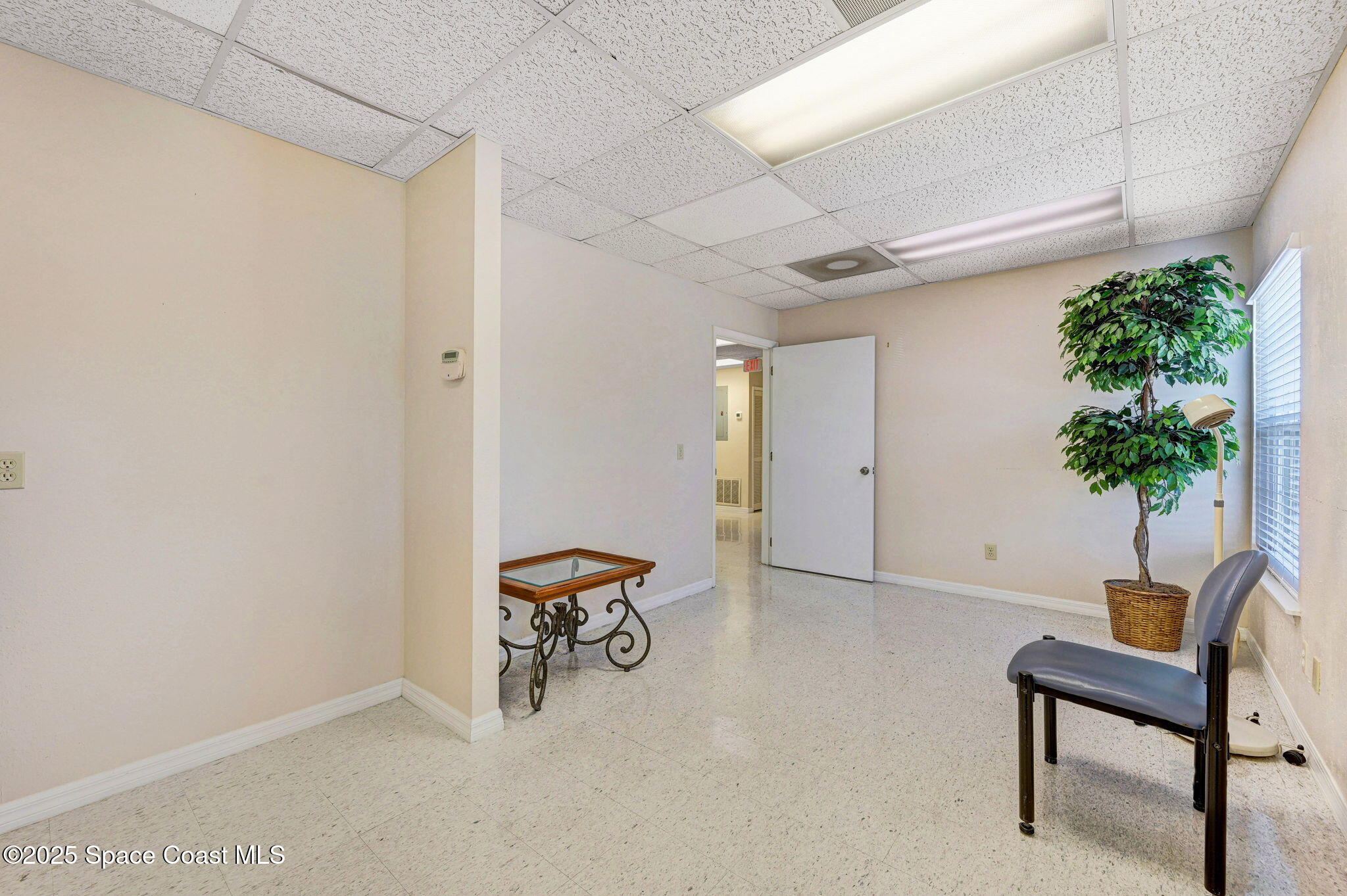 1801 Sarno Road, Unit 5 & 6 Melbourne, FL 32935 - Photo 28 of 44 a view of workspace with furniture and potted plant
