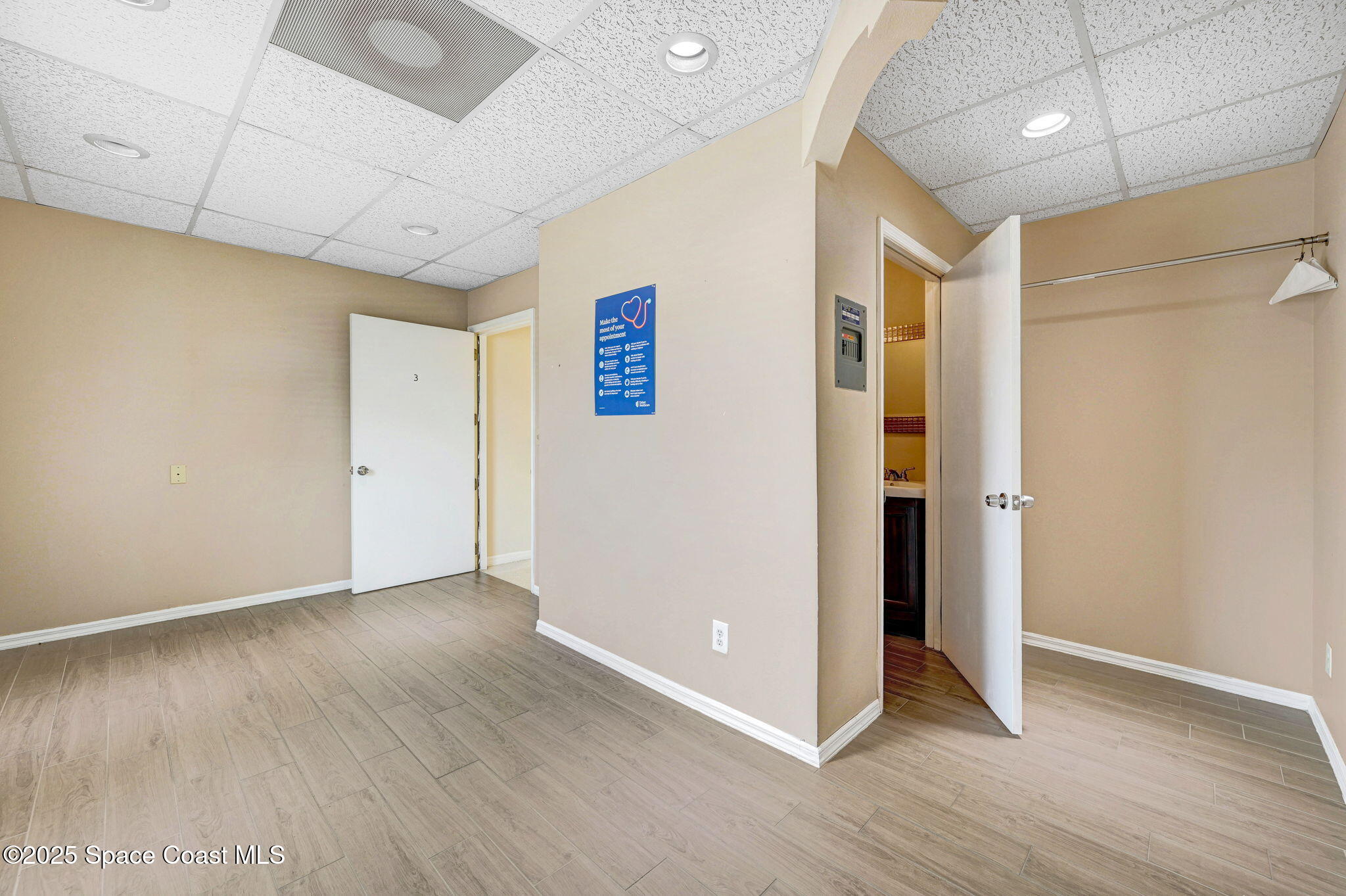 1801 Sarno Road, Unit 5 & 6 Melbourne, FL 32935 - Photo 29 of 44 a view of an empty room with wooden floor