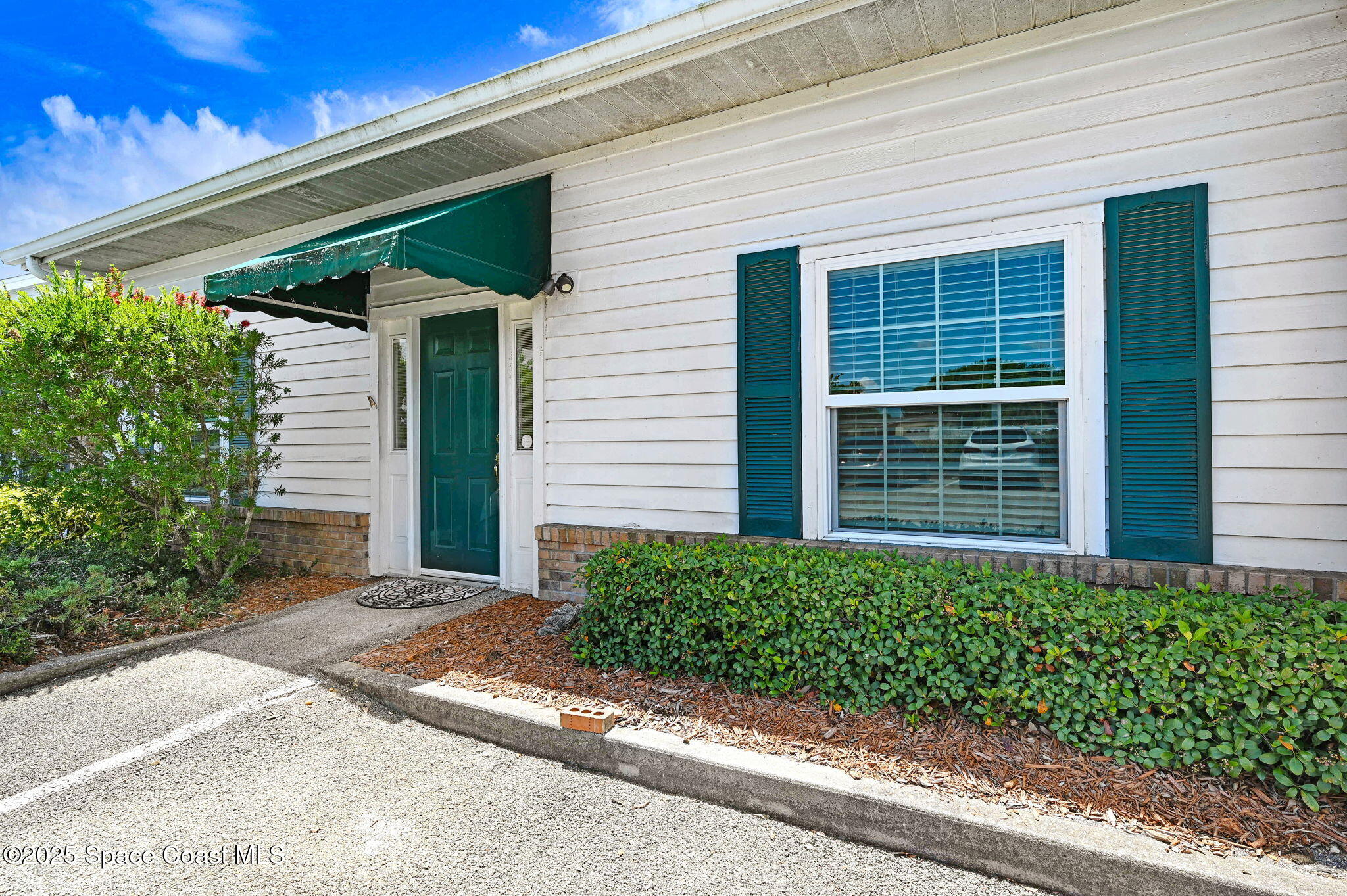 1801 Sarno Road, Unit 5 & 6 Melbourne, FL 32935 - Photo 30 of 44 a front view of a house with a yard