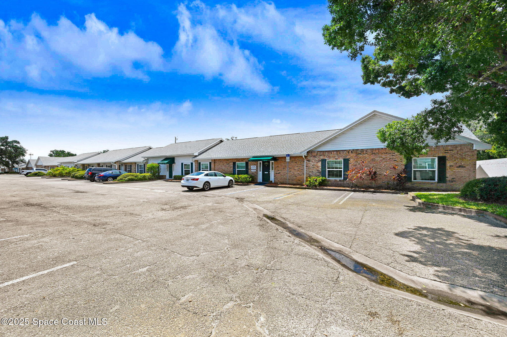 1801 Sarno Road, Unit 5 & 6 Melbourne, FL 32935 - Photo 3 of 44 a view of street with cars