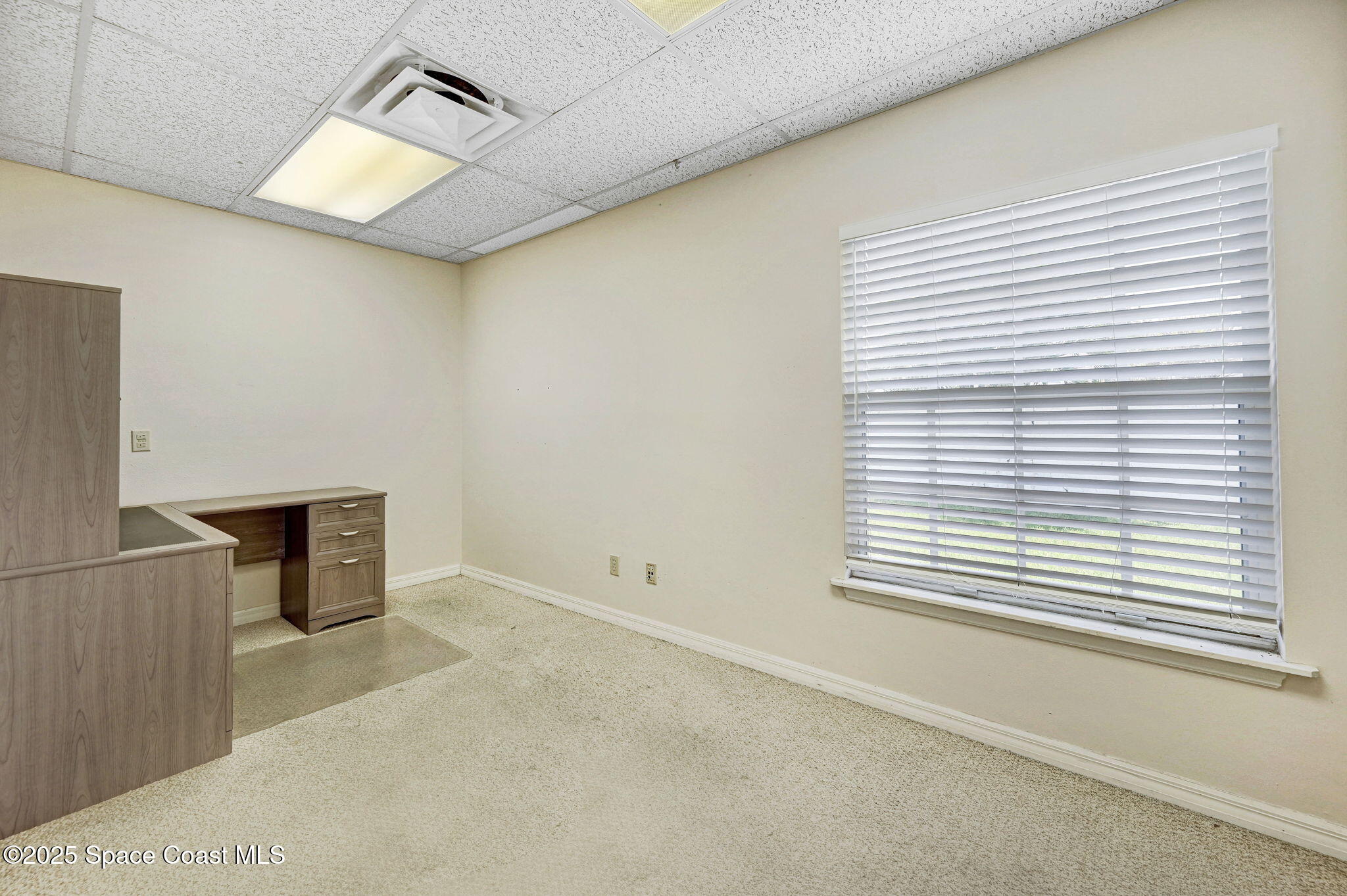 1801 Sarno Road, Unit 5 & 6 Melbourne, FL 32935 - Photo 34 of 44 a view of an empty room with a window