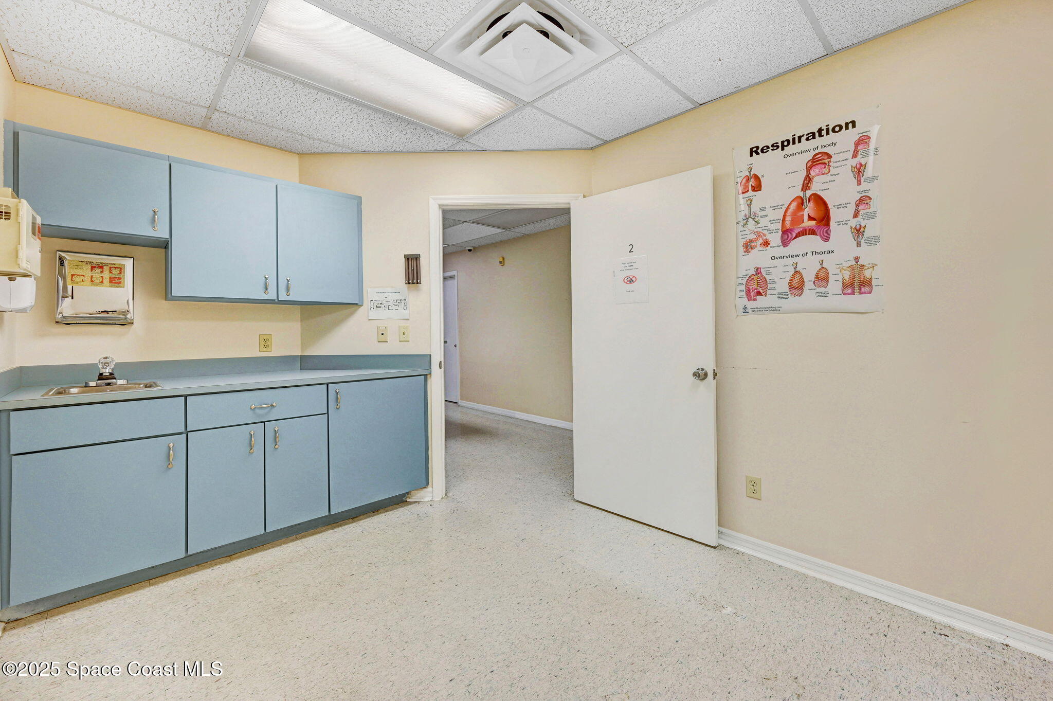 1801 Sarno Road, Unit 5 & 6 Melbourne, FL 32935 - Photo 39 of 44 a room with cabinets and wooden floor