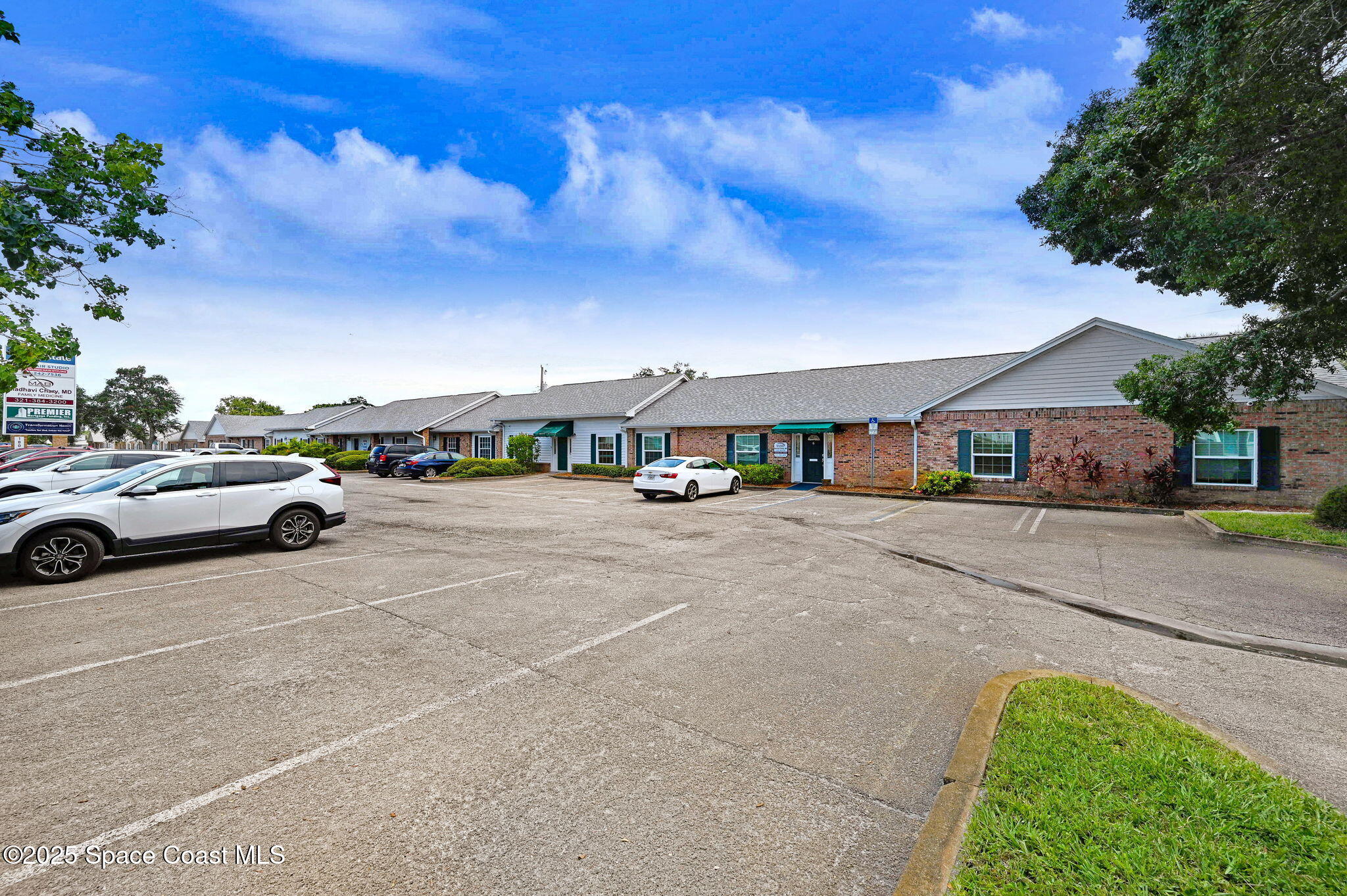 1801 Sarno Road, Unit 5 & 6 Melbourne, FL 32935 - Photo 40 of 44 a view of street with parked cars