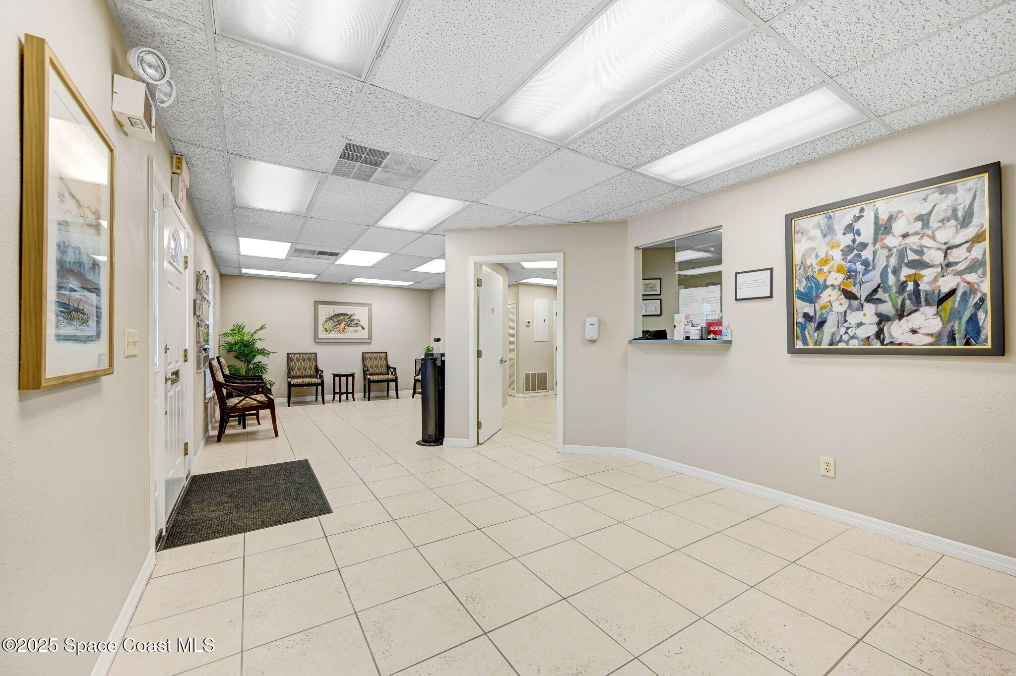 1801 Sarno Road, Unit 5 & 6 Melbourne, FL 32935 - Photo 4 of 44 a view of a hallway with wooden floor and a large window