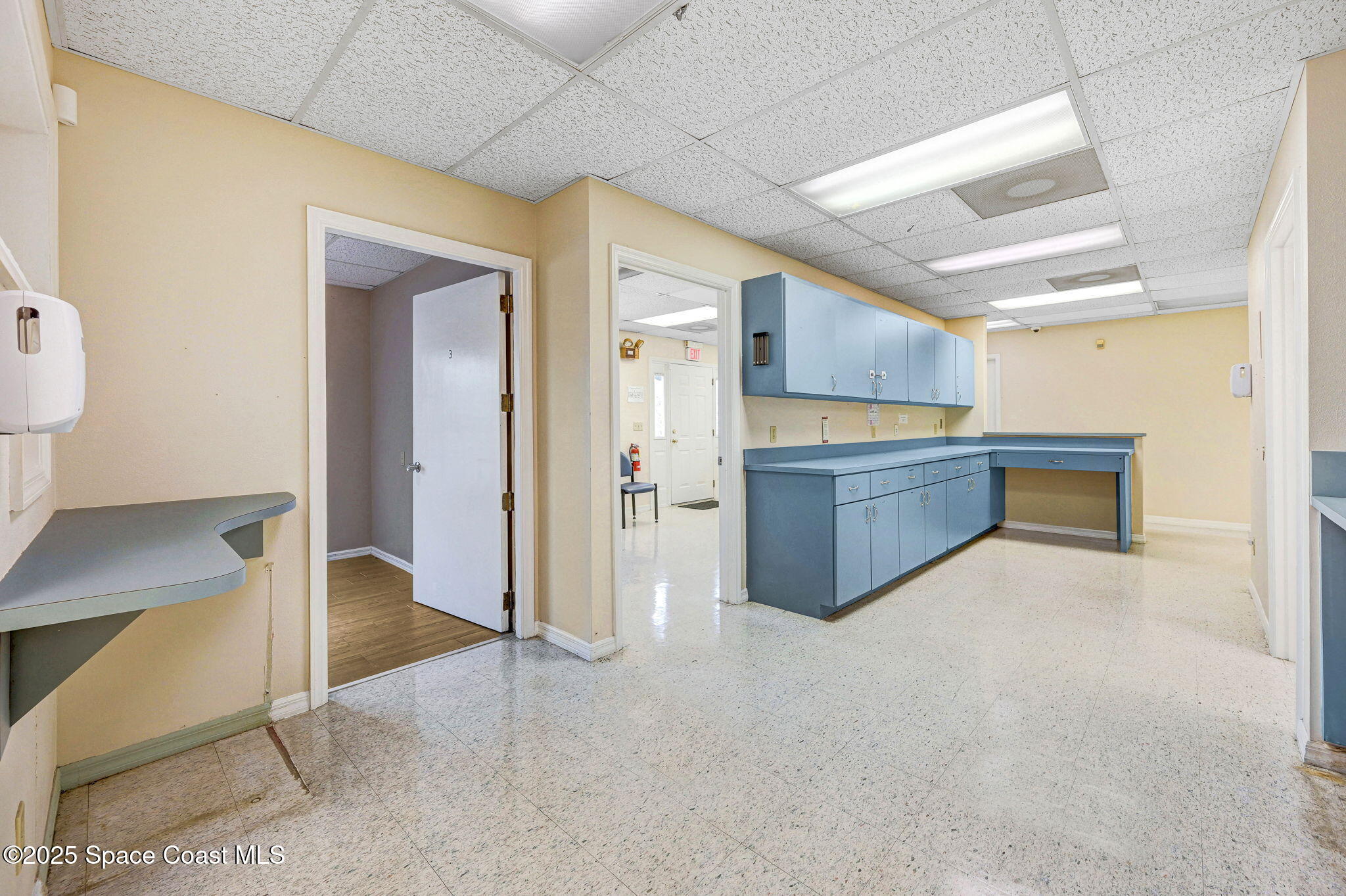 1801 Sarno Road, Unit 5 & 6 Melbourne, FL 32935 - Photo 42 of 44 a open kitchen with cabinets and wooden floor