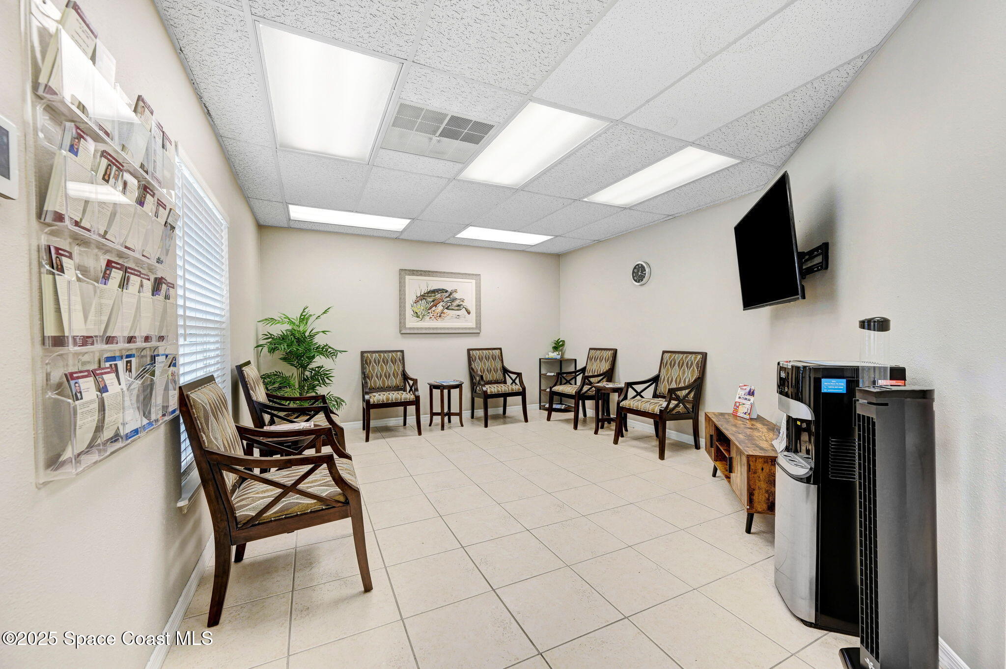 1801 Sarno Road, Unit 5 & 6 Melbourne, FL 32935 - Photo 5 of 44 a view of a livingroom with furniture and a flat screen tv