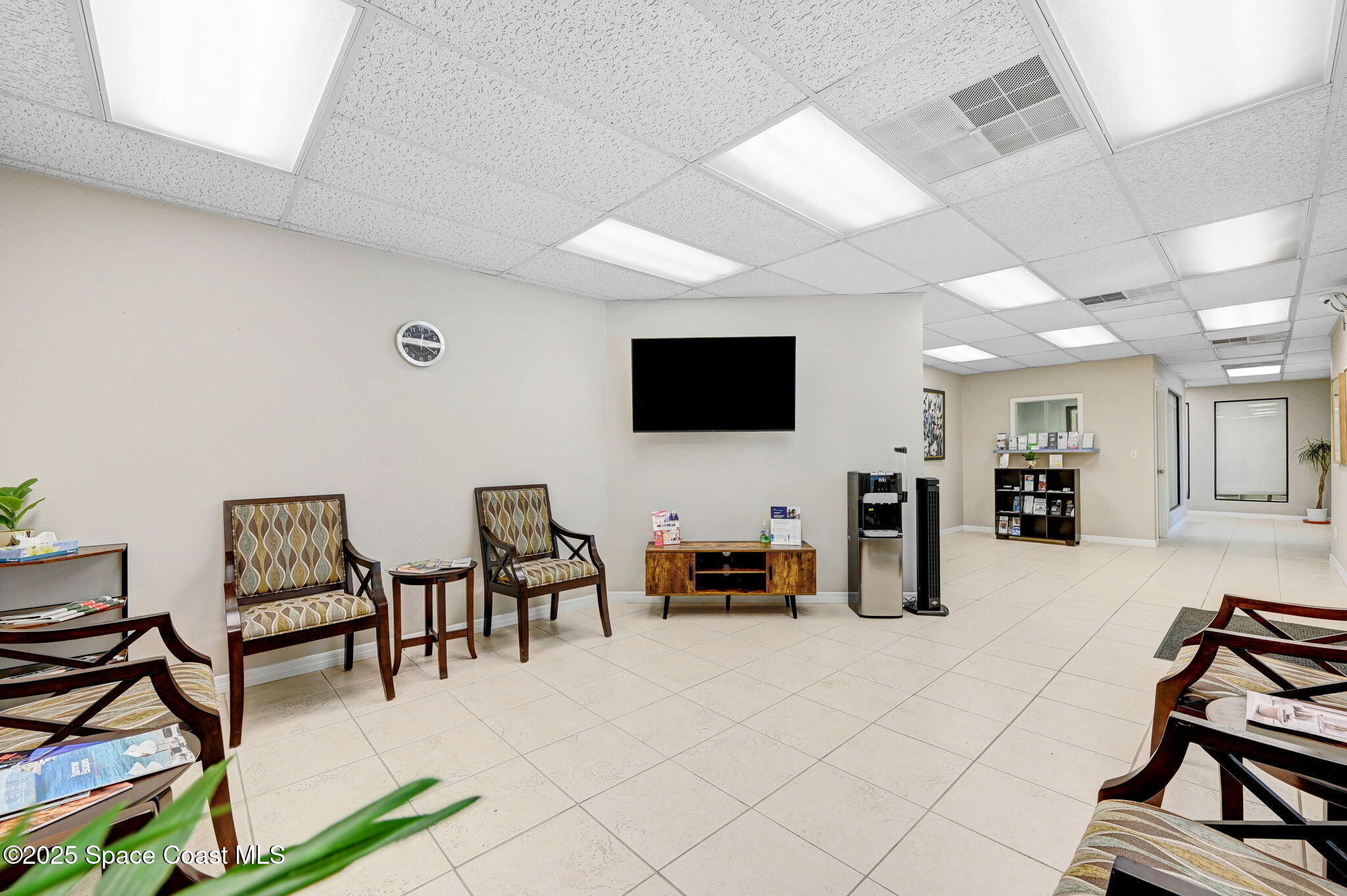 1801 Sarno Road, Unit 5 & 6 Melbourne, FL 32935 - Photo 6 of 44 a living room with furniture and a flat screen tv
