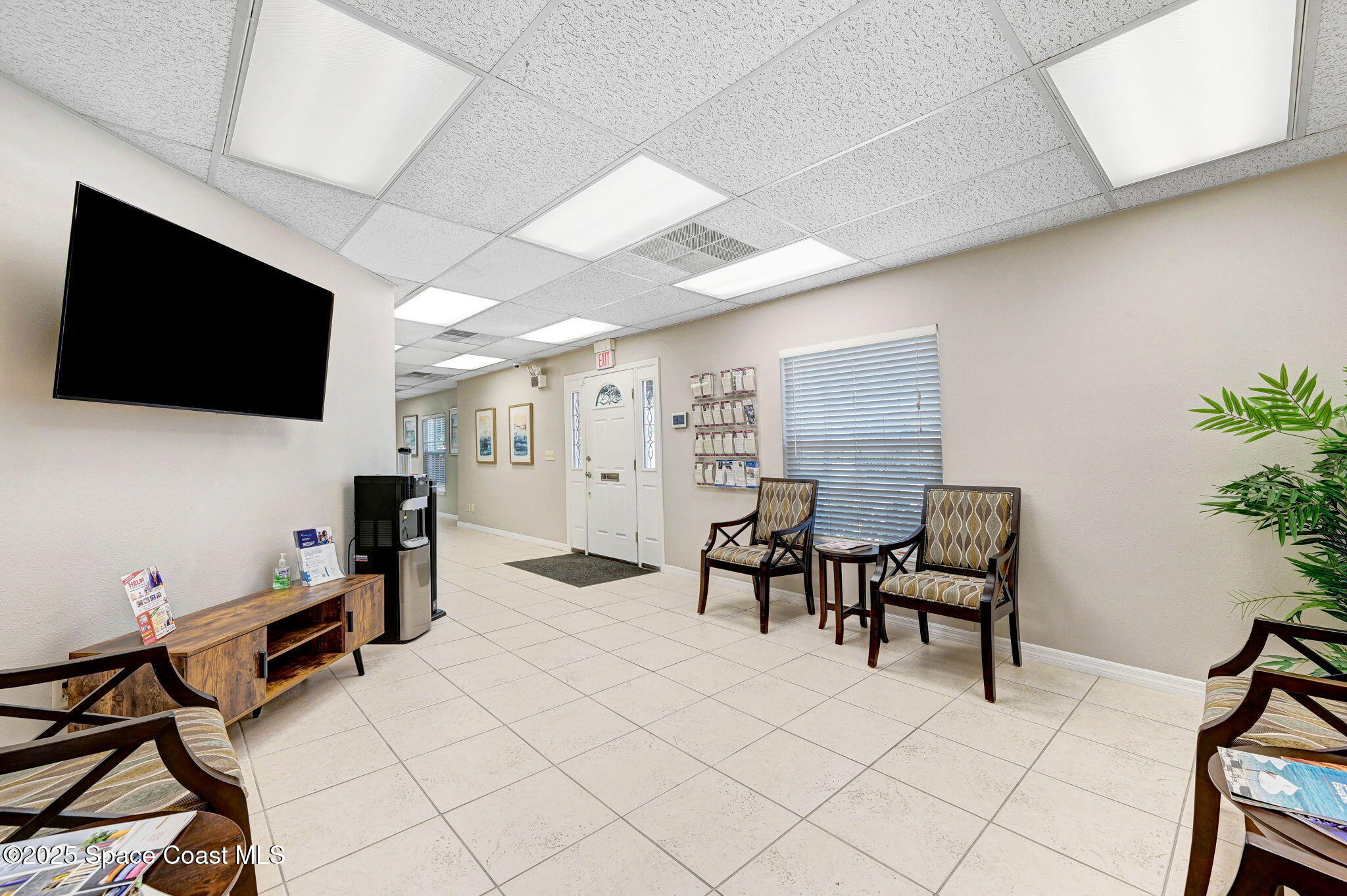 1801 Sarno Road, Unit 5 & 6 Melbourne, FL 32935 - Photo 7 of 44 a livingroom with furniture and a flat screen tv