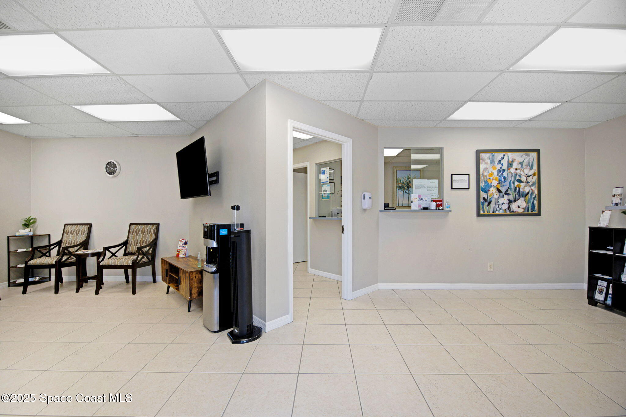 1801 Sarno Road, Unit 5 & 6 Melbourne, FL 32935 - Photo 8 of 44 a living room with stainless steel appliances furniture and a flat screen tv