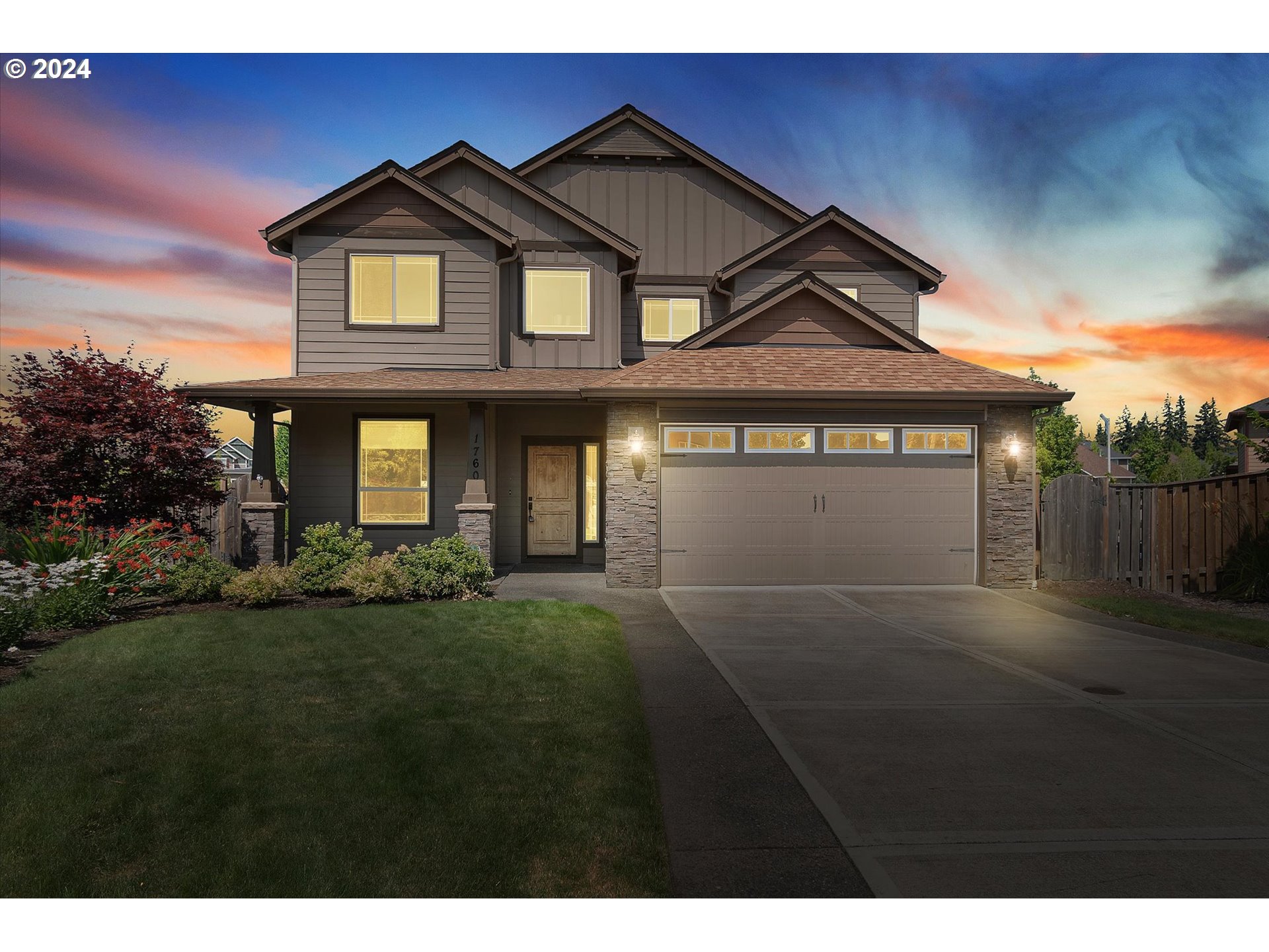 1760 South 18th Circle Ridgefield, WA 98642 - Photo 1 of 36 a front view of a house with a garden and yard