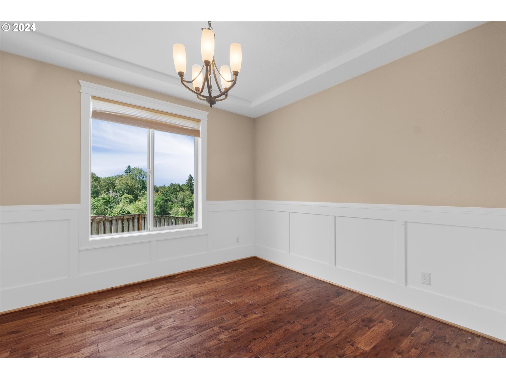 1760 South 18th Circle Ridgefield, WA 98642 - Photo 18 of 36 a view of an empty room with wooden floor and a window
