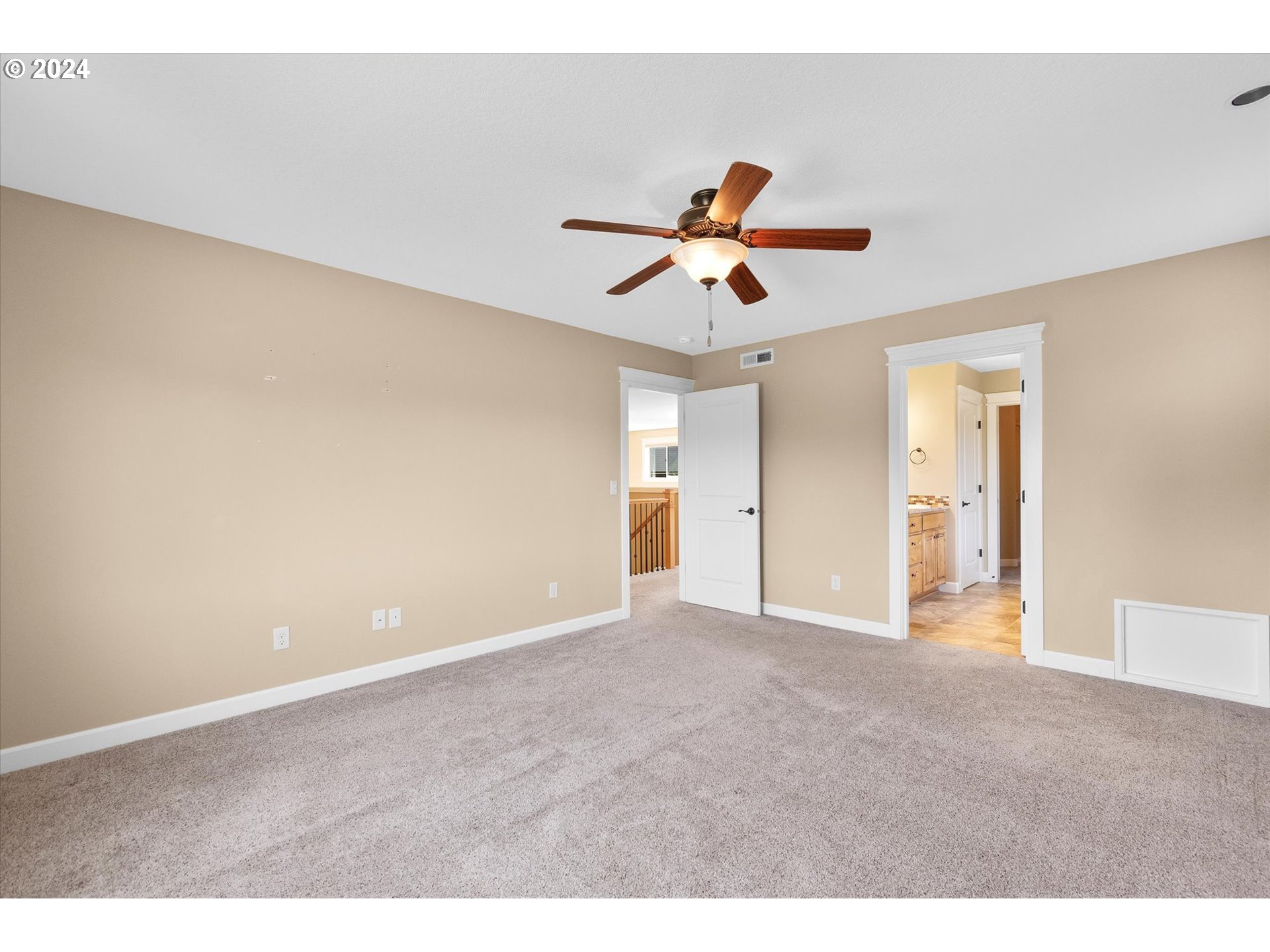 1760 South 18th Circle Ridgefield, WA 98642 - Photo 29 of 36 a view of a big room with wooden floor and a chandelier fan