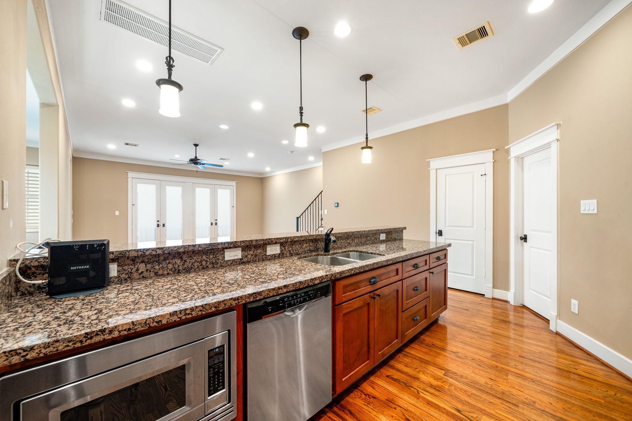 229 Knox Street Houston, TX 77007 - Photo 15 of 33 a kitchen with granite countertop a sink a counter space and stainless steel appliances