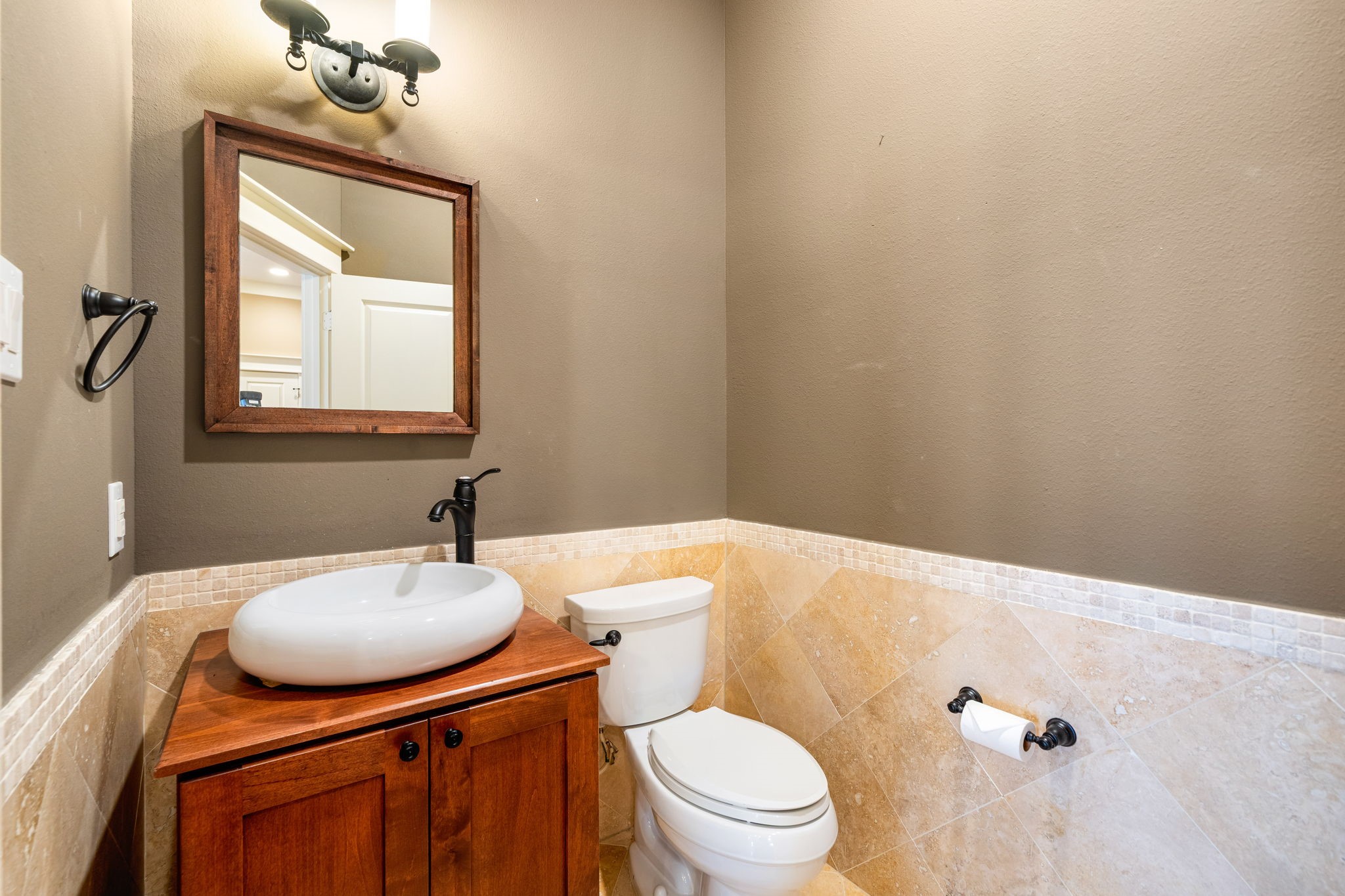 229 Knox Street Houston, TX 77007 - Photo 16 of 33 a bathroom with a sink a toilet and mirror