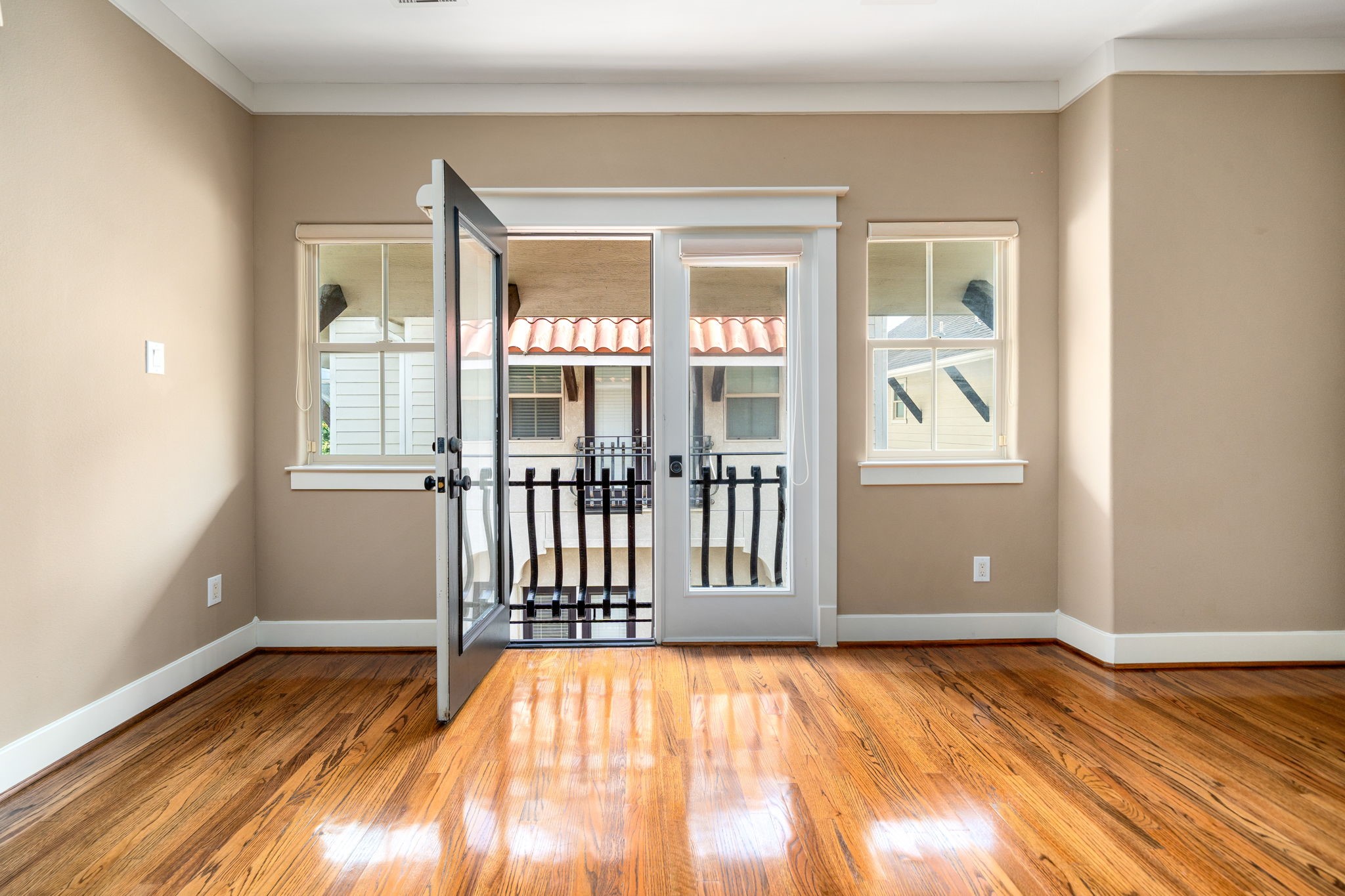 229 Knox Street Houston, TX 77007 - Photo 22 of 33 a view of empty room with wooden floor and fan