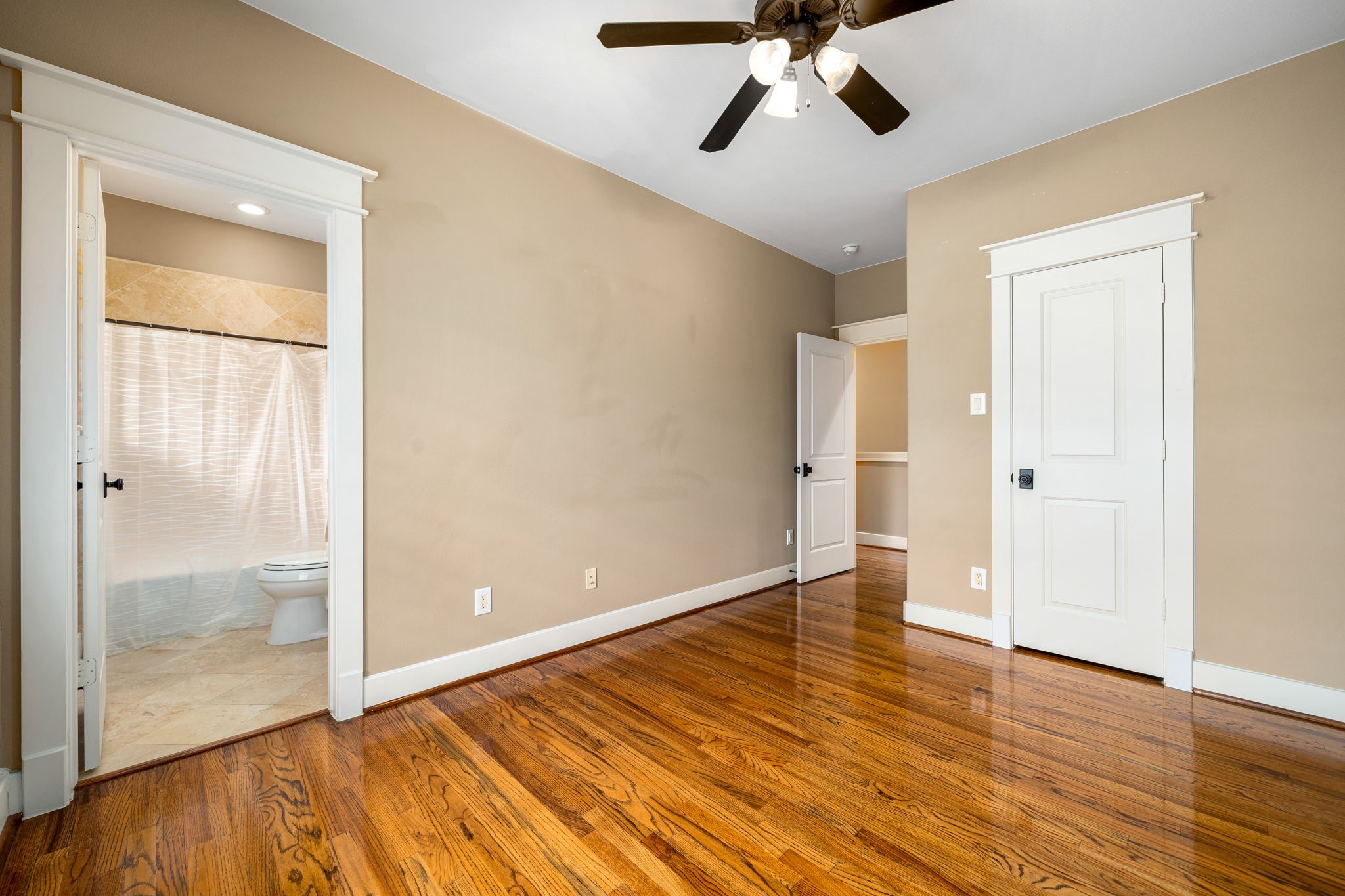 229 Knox Street Houston, TX 77007 - Photo 26 of 33 wooden floor in an empty room with a window