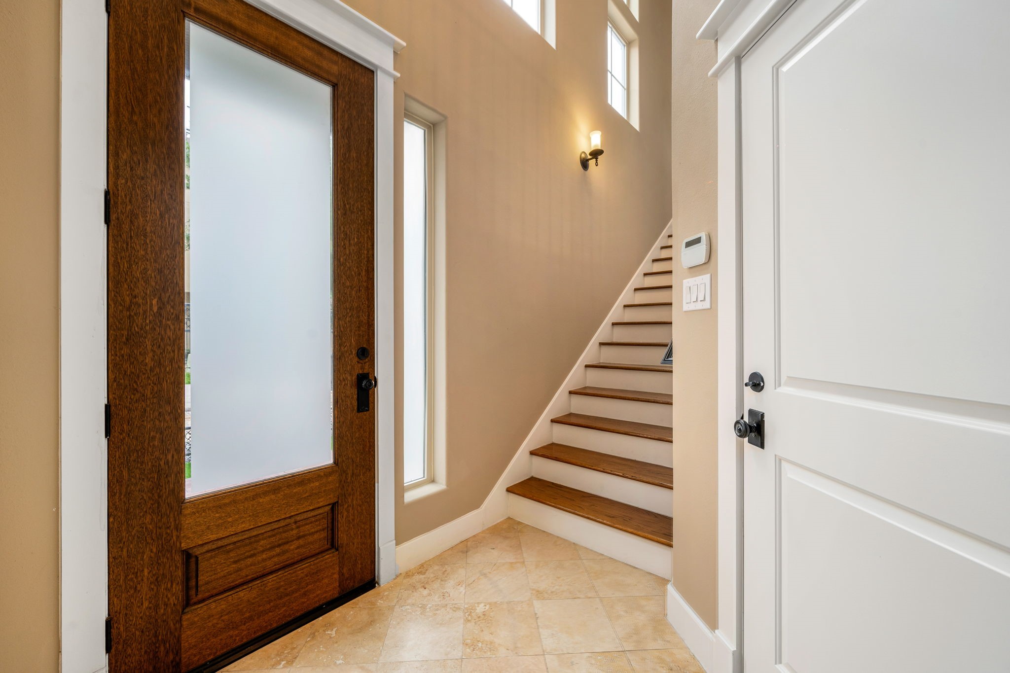 229 Knox Street Houston, TX 77007 - Photo 3 of 33 a view of a hallway with entryway and stairs
