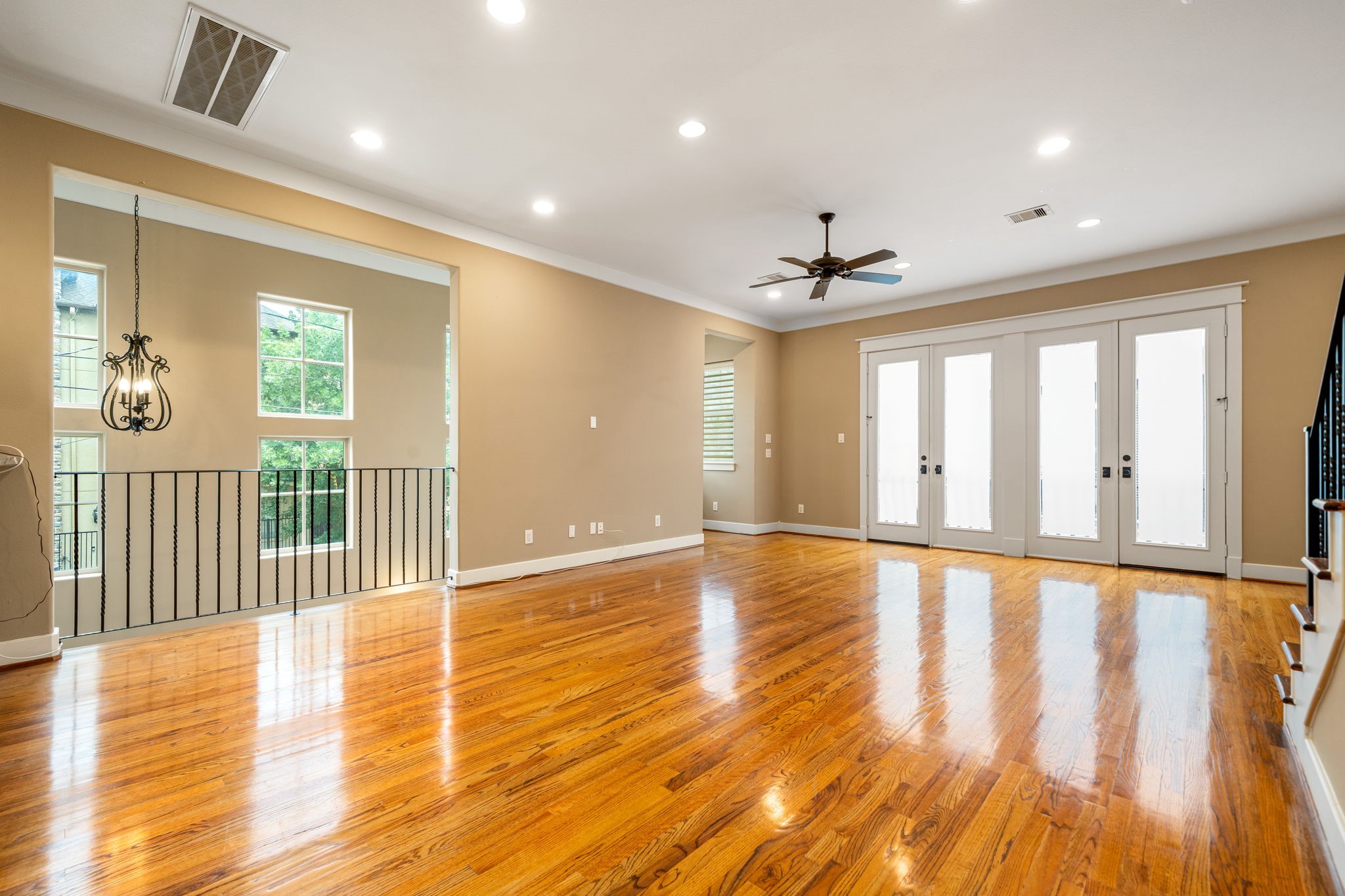 229 Knox Street Houston, TX 77007 - Photo 9 of 33 a view of an empty room with wooden floor