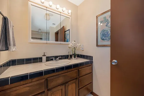 an aerial view of a residential houses with outdoor space and street view