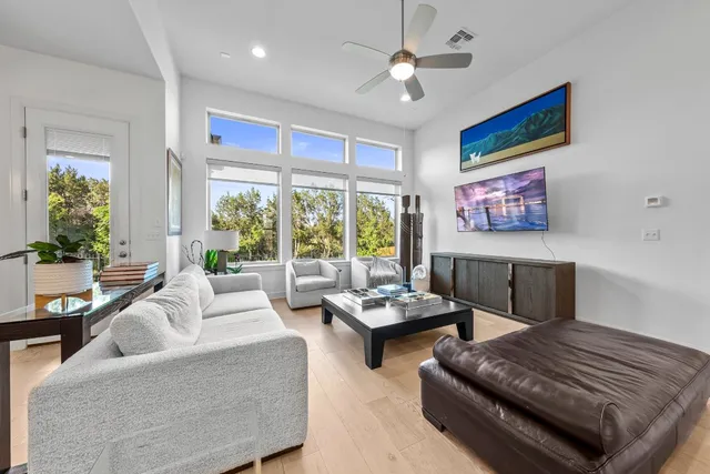 a living room with furniture and a large window