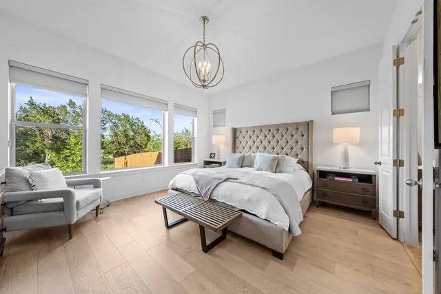 a bedroom with a bed couch and window