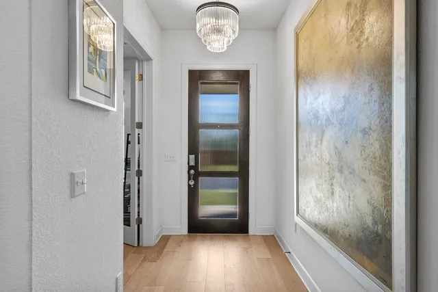 a view of an entryway with wooden floor