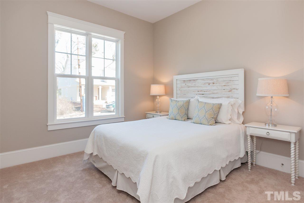 2619 Davis Street Raleigh, NC 27608 - Photo 12 of 25 a bedroom with a bed and a window