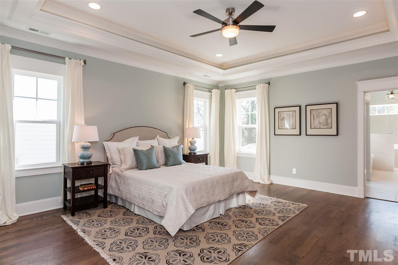 2619 Davis Street Raleigh, NC 27608 - Photo 14 of 25 a bedroom with a large bed and a window