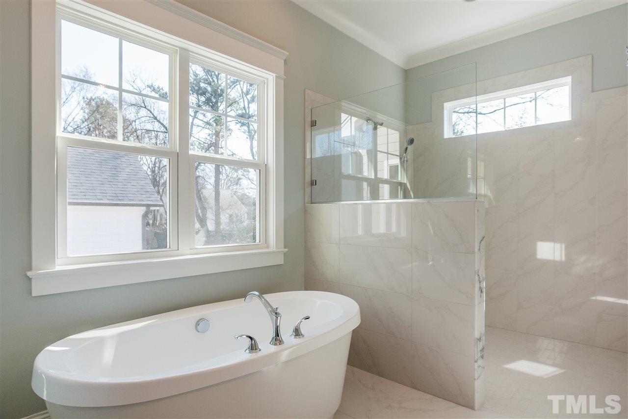 2619 Davis Street Raleigh, NC 27608 - Photo 16 of 25 a white bath tub sitting next to a window