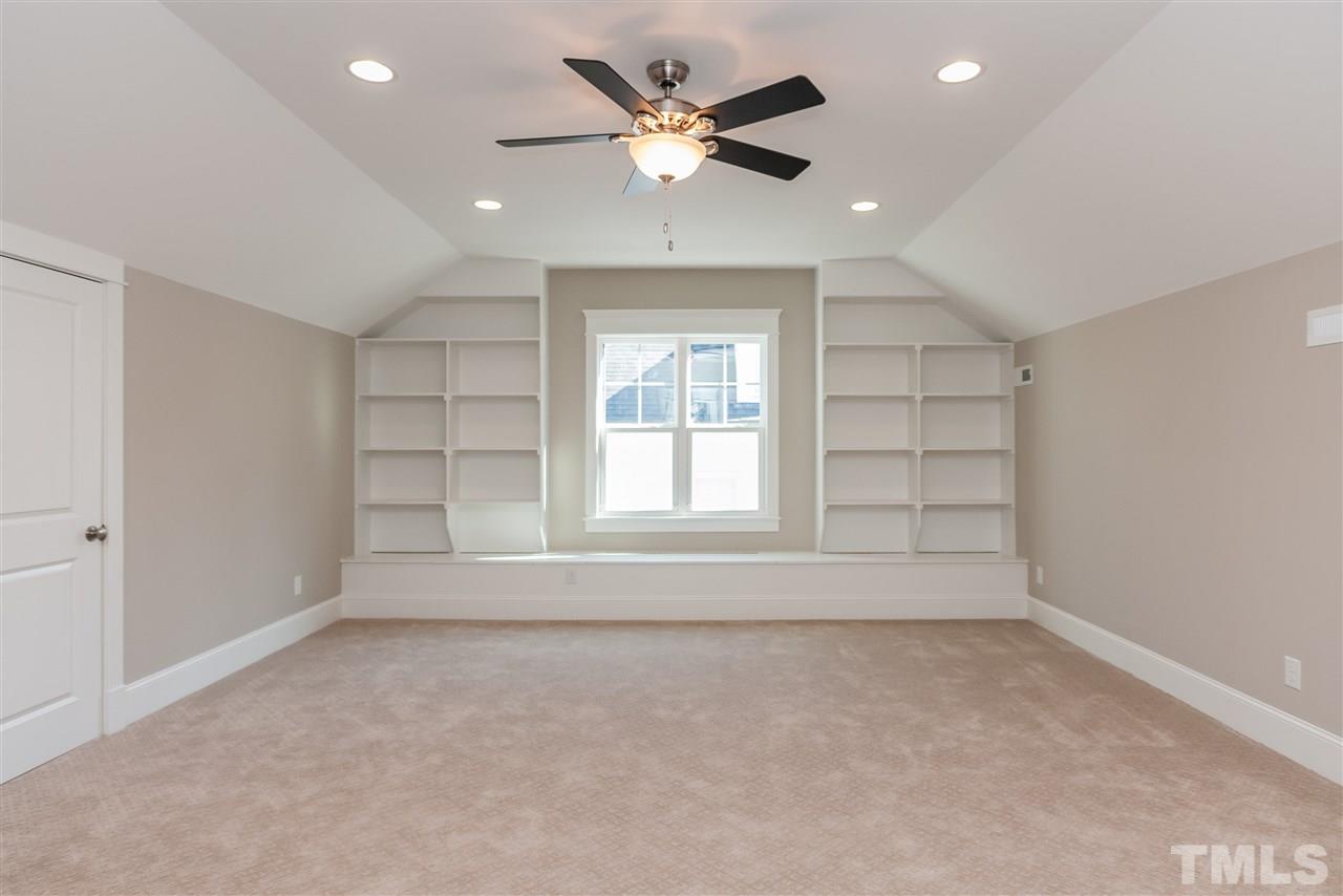 2619 Davis Street Raleigh, NC 27608 - Photo 23 of 25 an empty room with an empty space and a ceiling fan