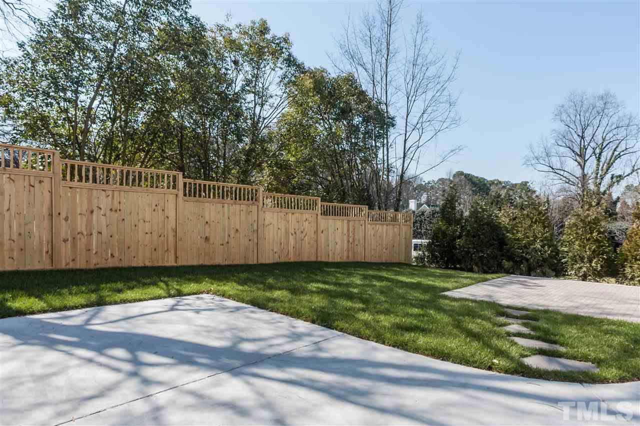 2619 Davis Street Raleigh, NC 27608 - Photo 24 of 25 a view of a backyard with wooden fence