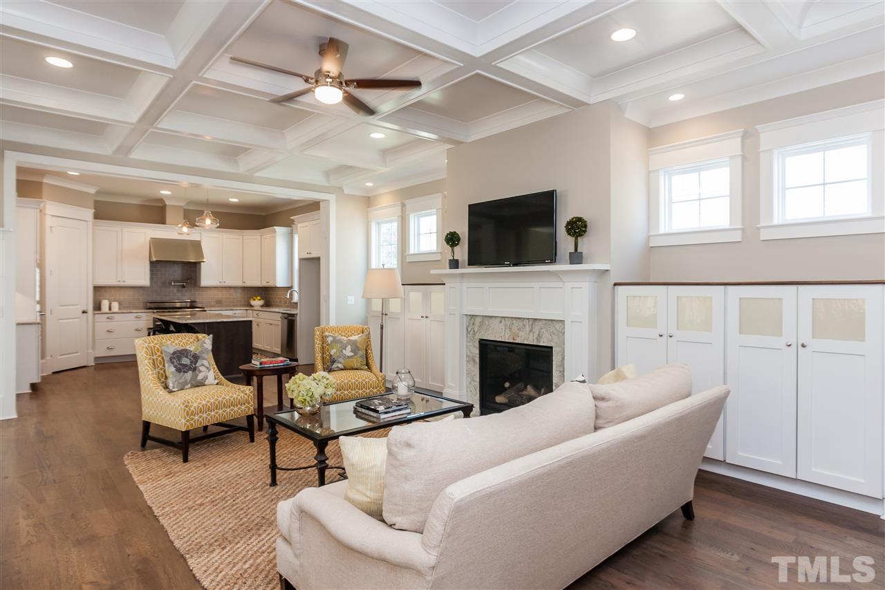 2619 Davis Street Raleigh, NC 27608 - Photo 4 of 25 a living room with furniture a fireplace and a flat screen tv