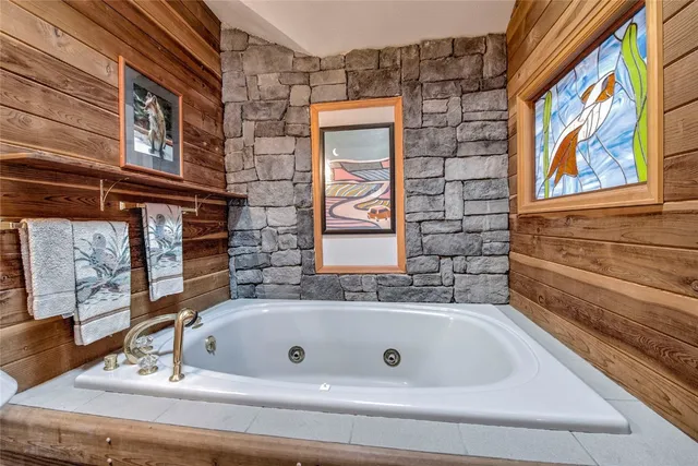 a bath tub sitting next to a window