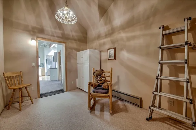 a hallway with a desk and furniture