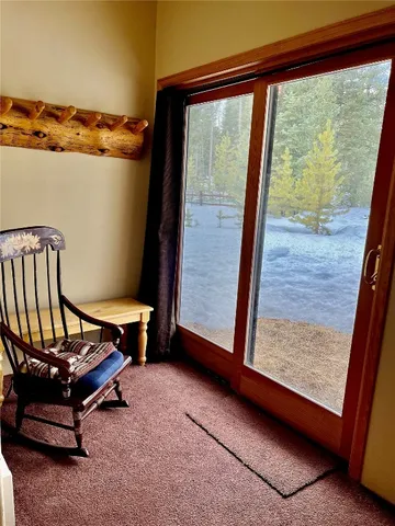 a view of a room with furniture and a window