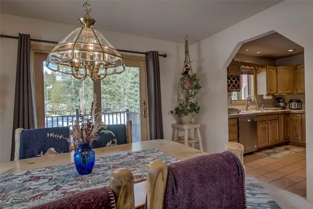 a bedroom with bed and large windows